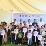 DHSUD Secretary Jose Ramon P. Aliling, Pag-IBIG Fund Chief Executive Officer Marilene B. Acosta, and P.A. Properties Chairman of the Board Romarico T. Alvarez joined beneficiaries of the Expanded Pambansang Pabahay para sa Pilipino (4PH) Program during the housing unit turnover ceremony at Nuvista Homes Lipa, Batangas
