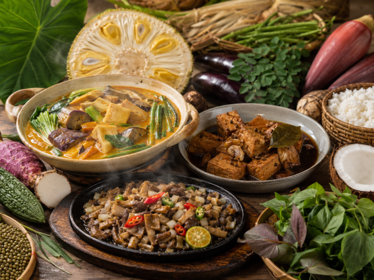 A variety of Asian dishes on a wooden table